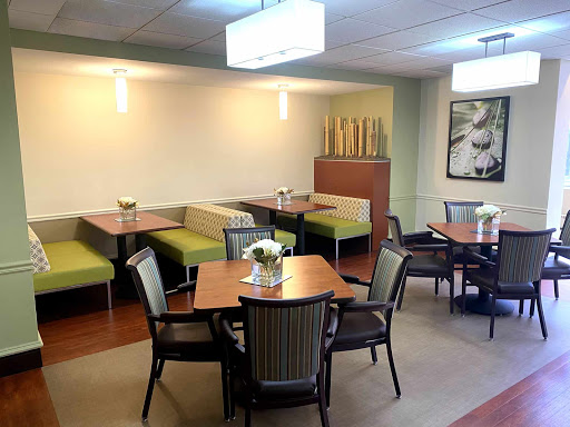 A welcoming dining area featuring modern furniture and a cozy atmosphere.