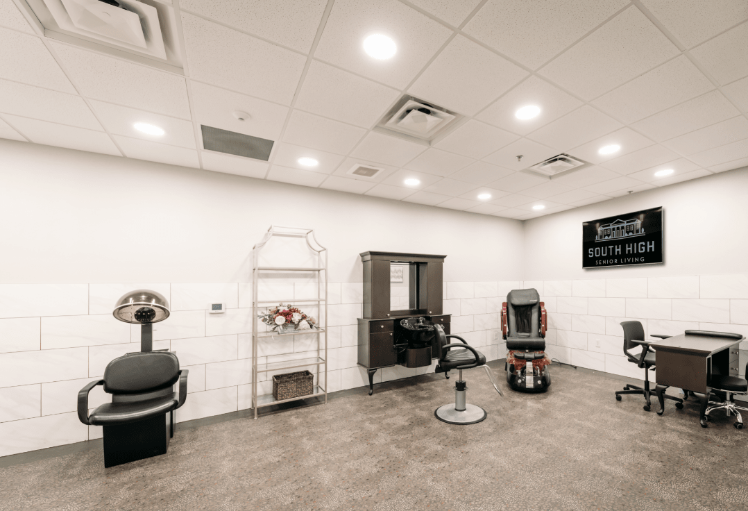 A modern salon interior with various beauty equipment and seating.