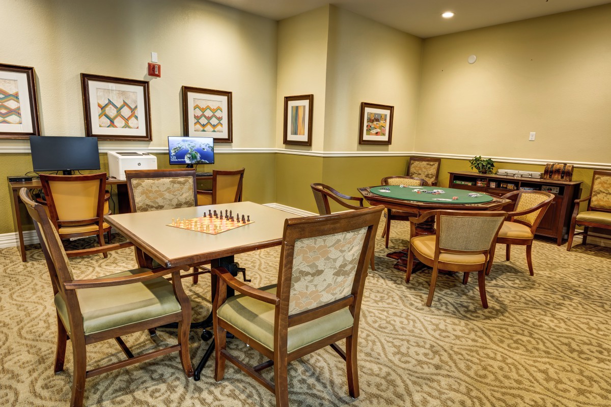 An inviting game room featuring tables set up for chess and other board games.