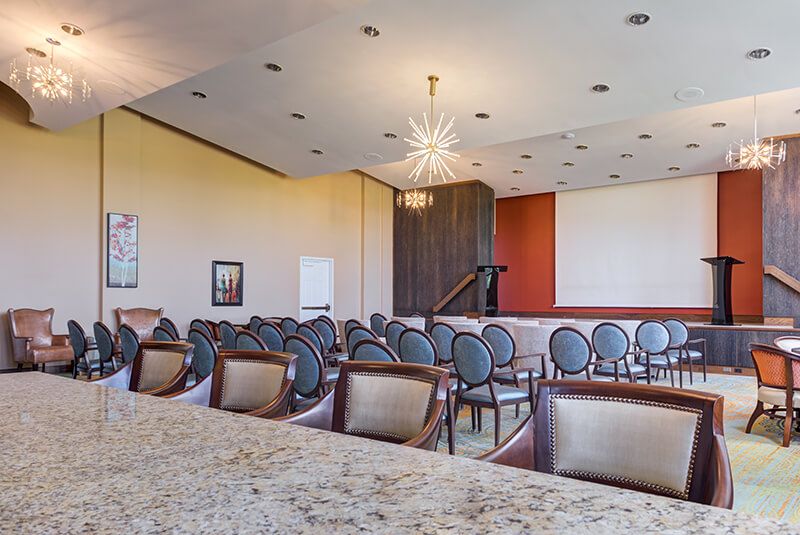 A modern conference room with elegant seating and stylish lighting.