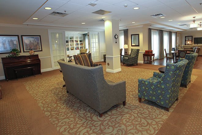 A spacious lobby with comfortable seating and elegant decor.