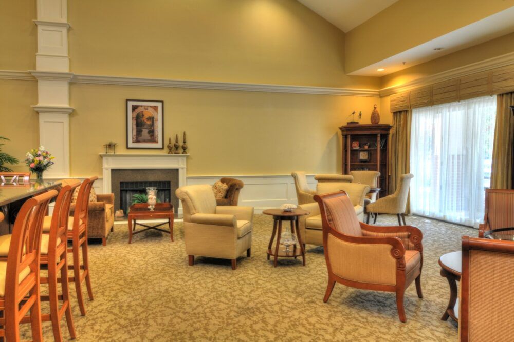 A cozy living room with plush seating and a fireplace.