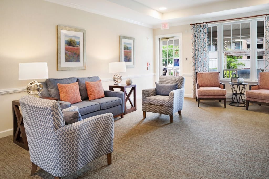 A cozy and elegantly designed living room with comfortable seating and tasteful decor.