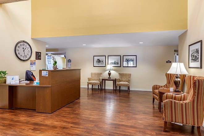 A welcoming hotel lobby with a reception desk and comfortable seating.