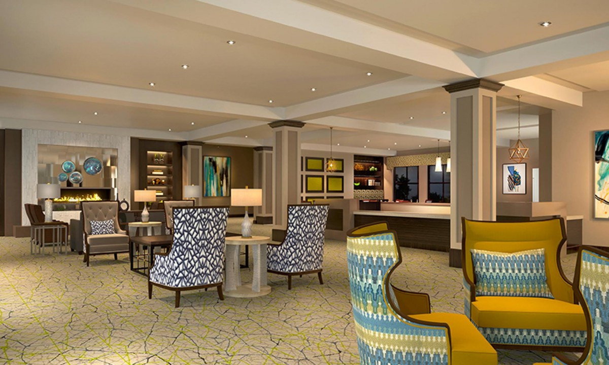 A modern hotel lobby with stylish seating and elegant decor.