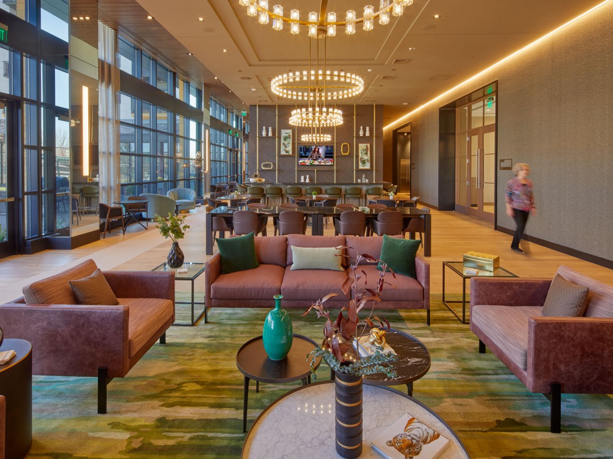 A spacious and modern lobby with stylish furniture and elegant lighting.