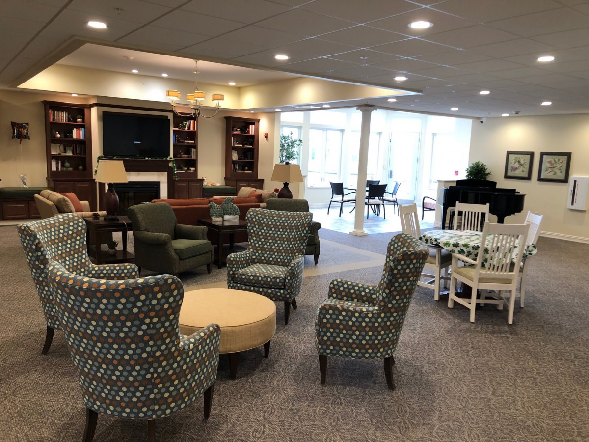 A cozy lounge area with comfortable seating and a television.