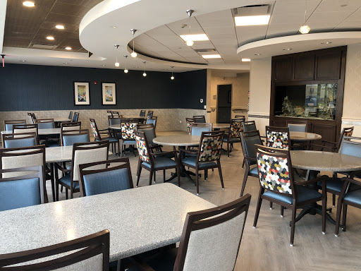 A modern dining area with elegant seating and a spacious layout.