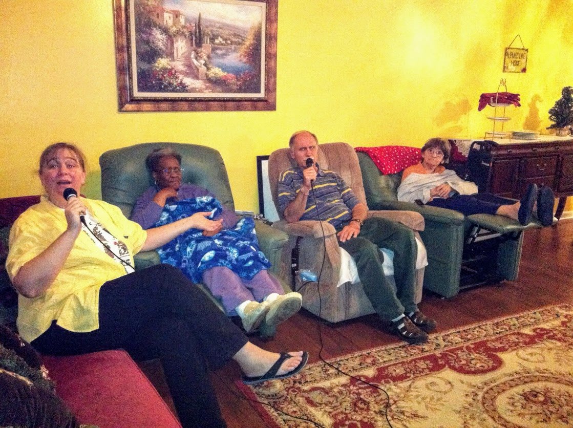 A group of people relaxing in a cozy living room.