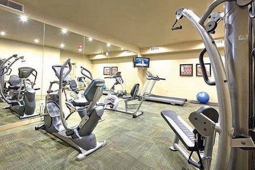 A well-equipped gym featuring various exercise machines for a complete workout.