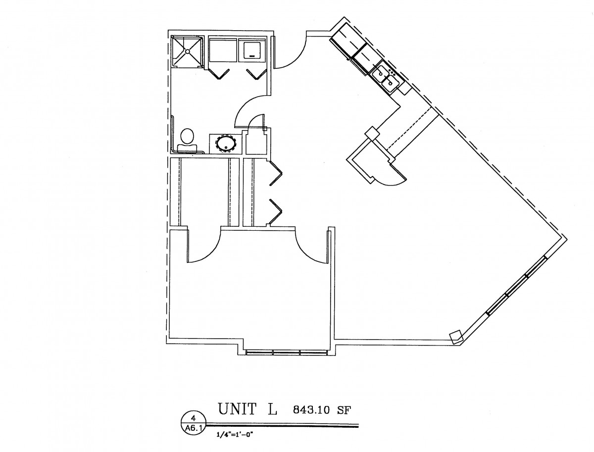 Floor plan of Unit L showing the layout of an apartment with a bathroom, kitchen, and living area.