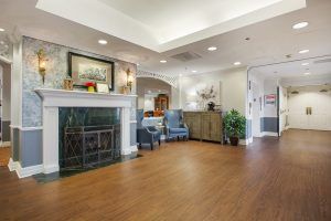A cozy living room with a fireplace and comfortable seating.