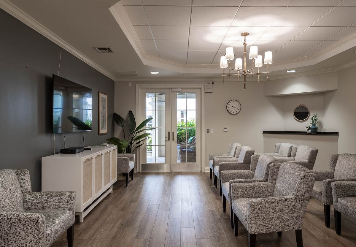 A modern waiting room with comfortable seating and elegant decor.