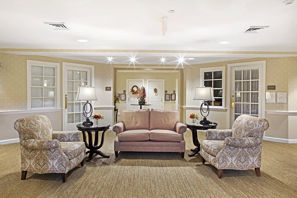 A cozy living room with elegant furniture and warm lighting.