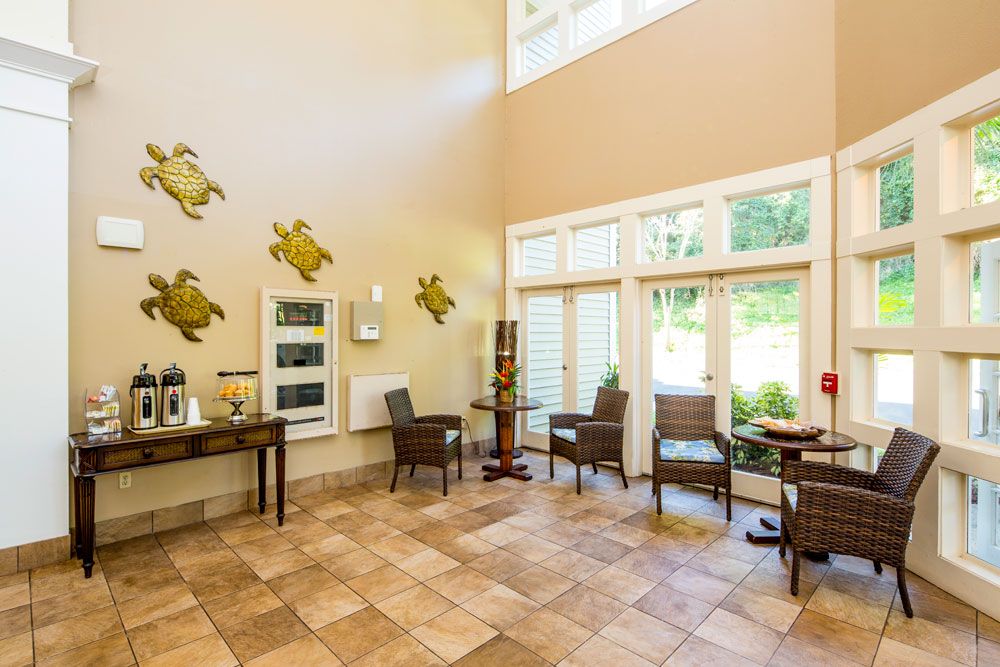 A welcoming lobby area with stylish furniture and decorative wall art.