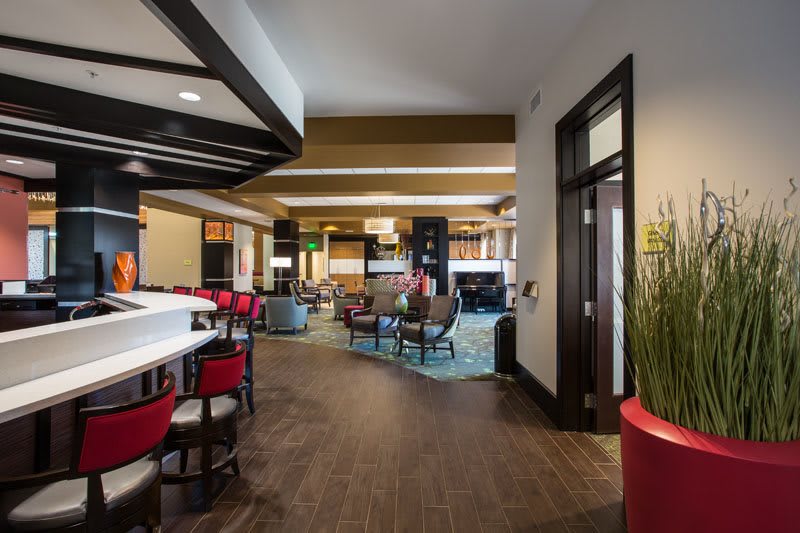 A modern hotel lobby with a welcoming seating area and stylish decor.