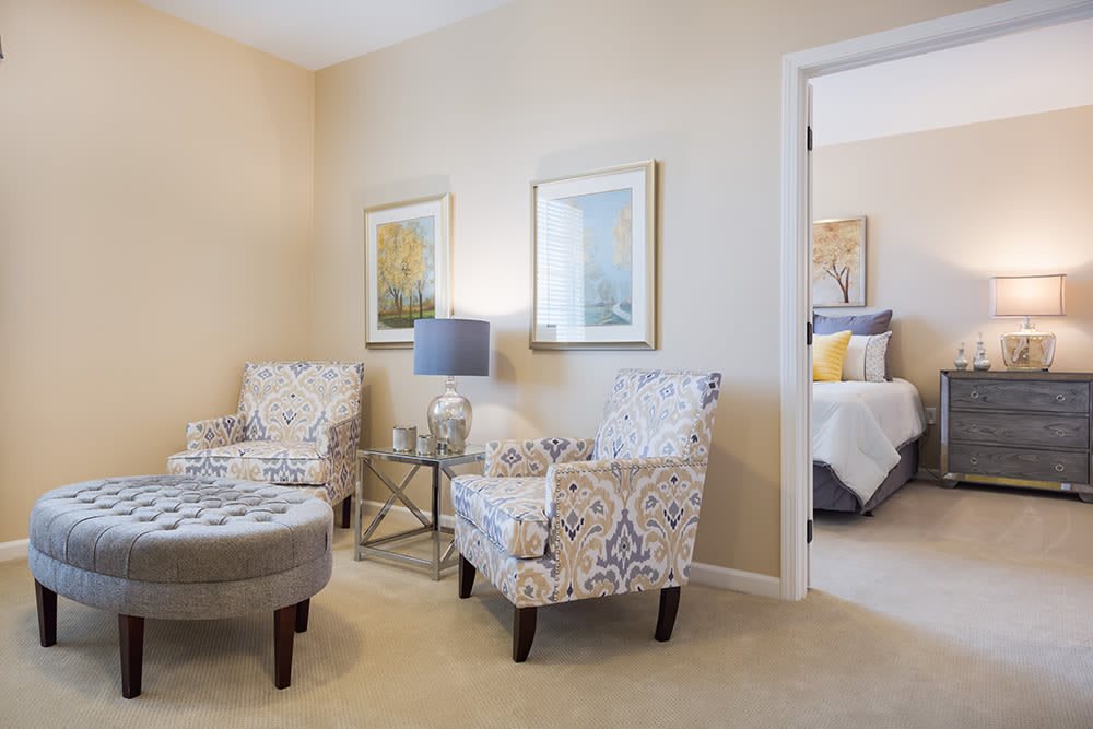 A stylish living room with patterned chairs and elegant decor.