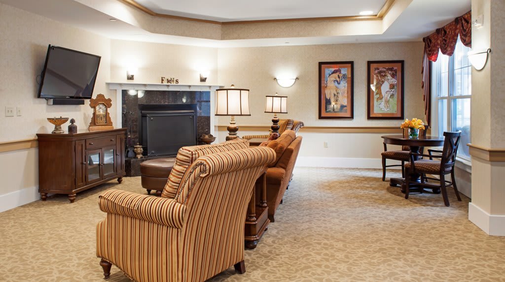 A cozy living room with stylish furniture and warm lighting.