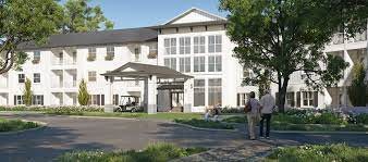 A modern residential building with a landscaped entrance.