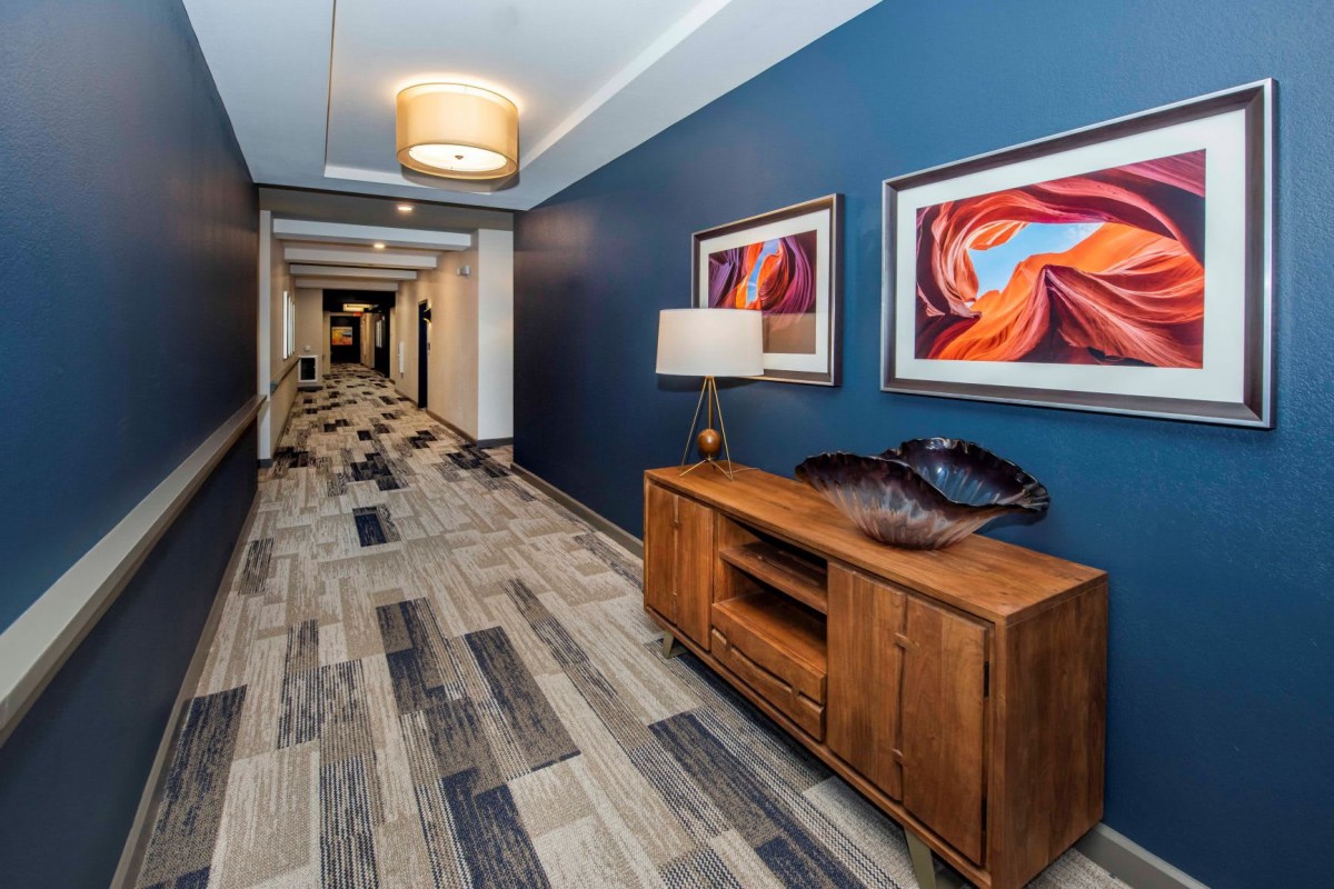 A stylish hallway with colorful artwork and modern decor.