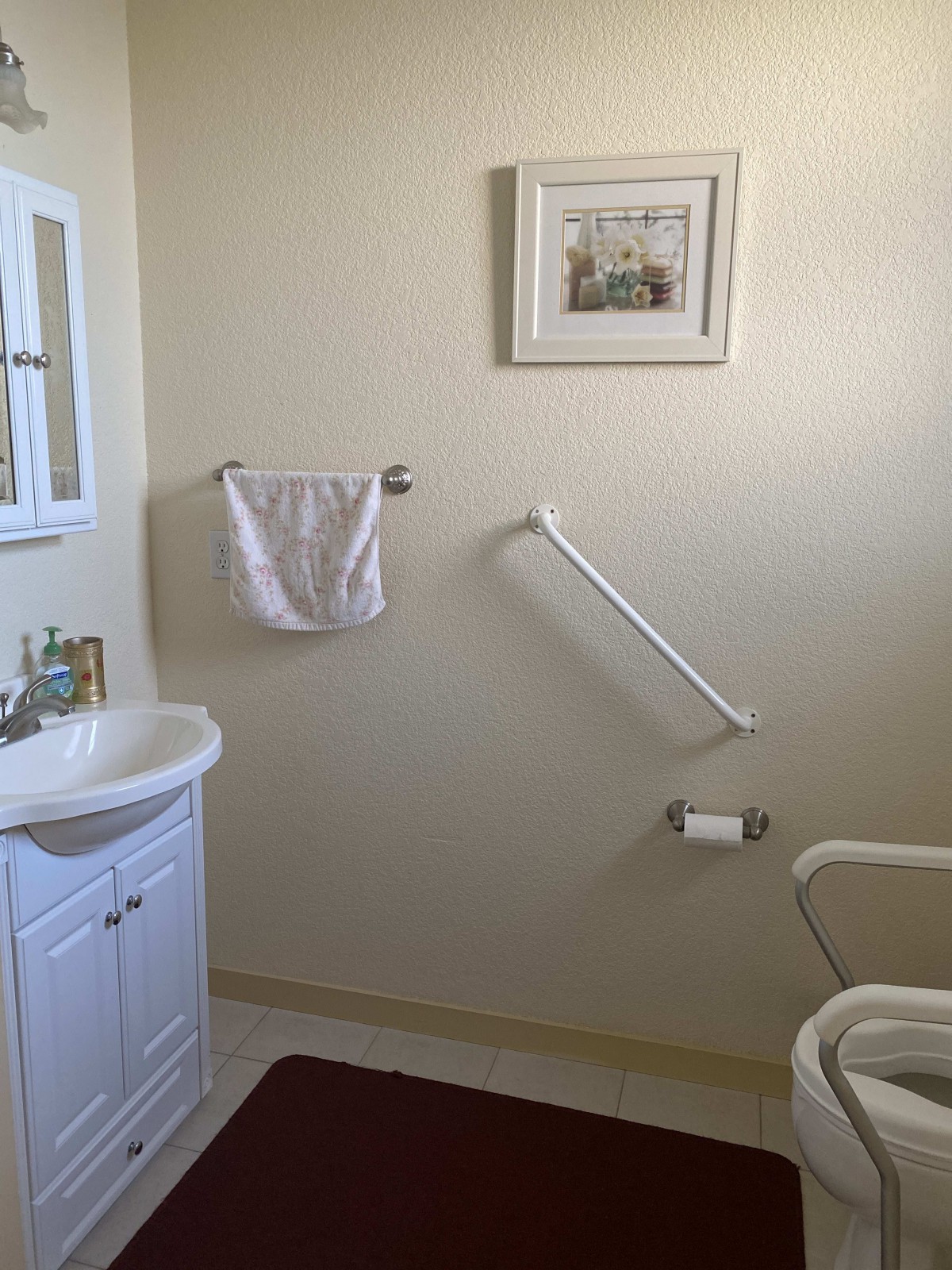 A clean and organized bathroom with essential amenities.