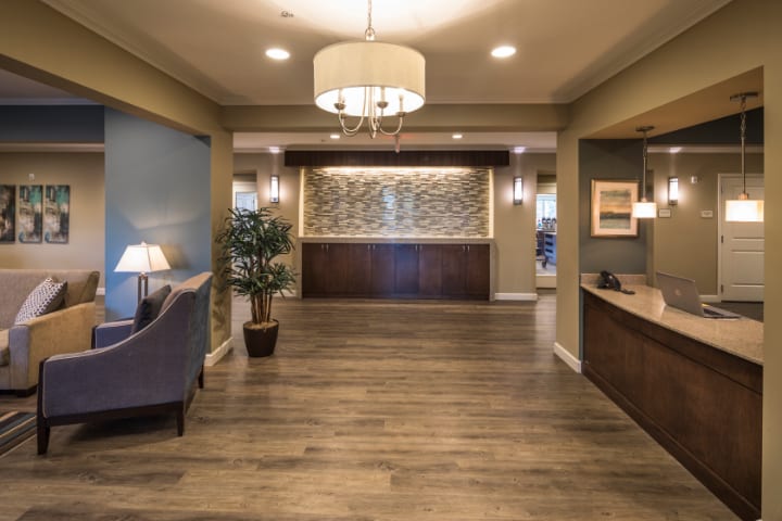 A modern lobby with elegant decor and wooden flooring.