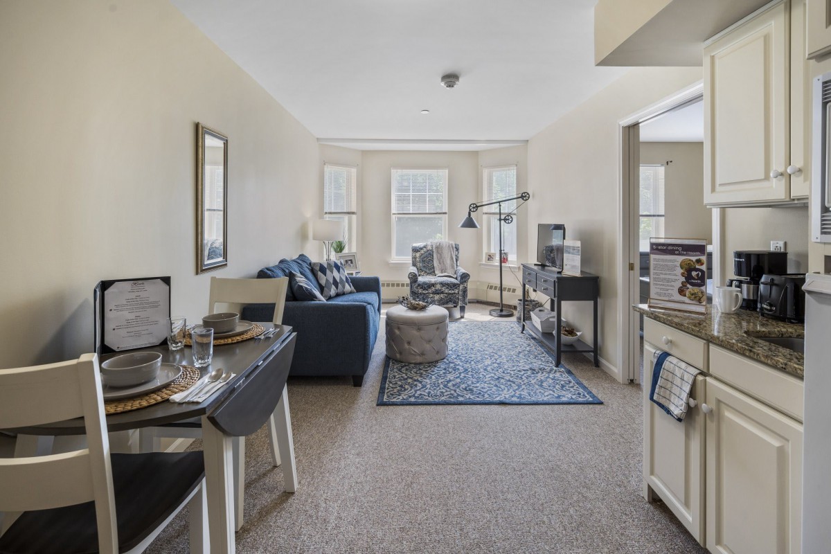 A cozy apartment living room with a sofa, coffee table, and stylish decor.