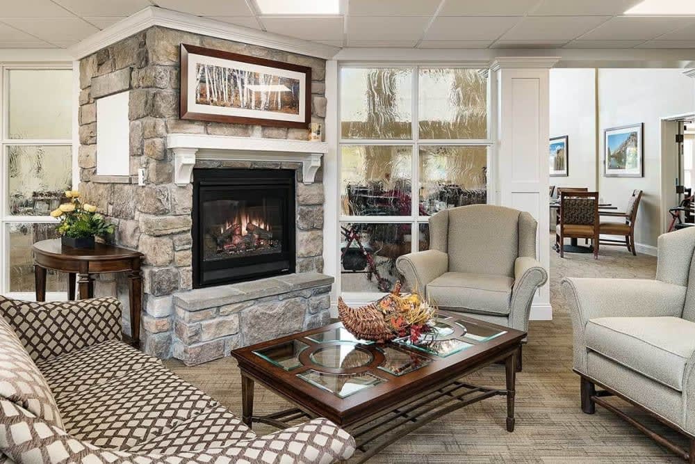 Cozy living room with a stone fireplace and comfortable seating.