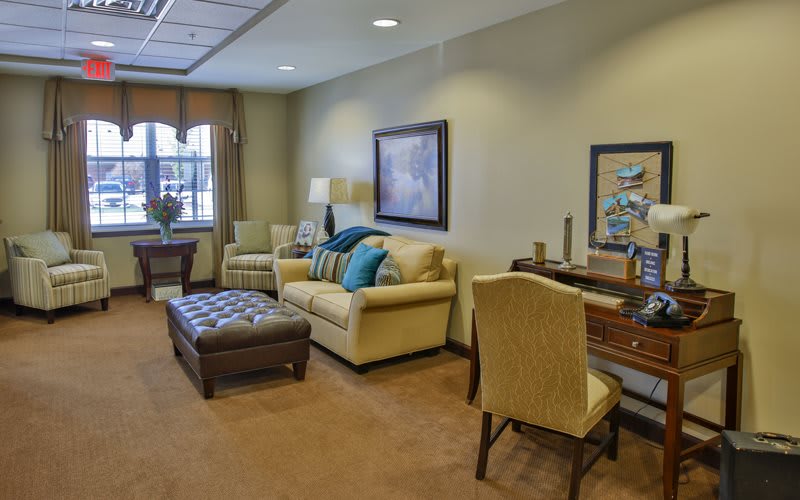 A cozy living room with elegant furniture and warm lighting.