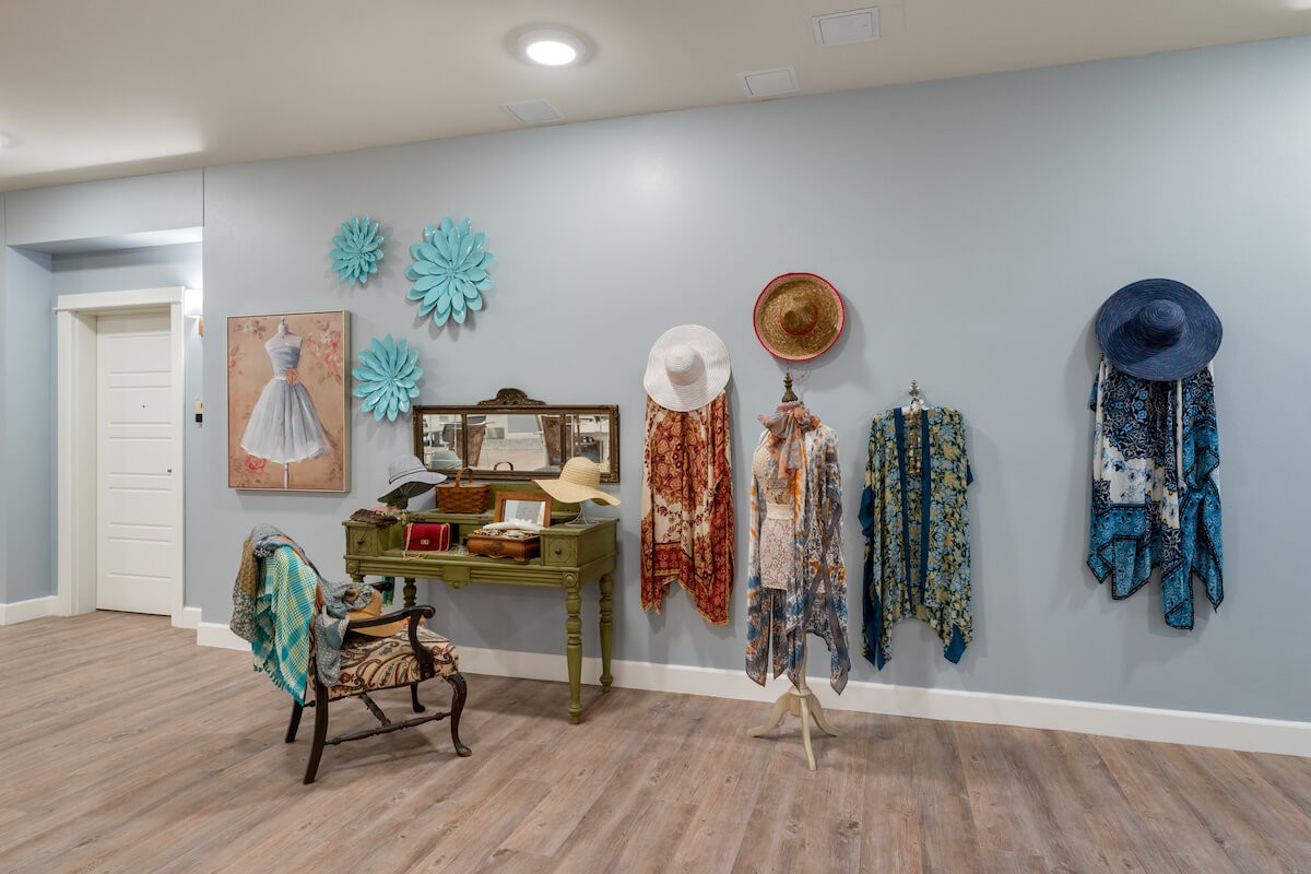 A stylish boutique interior with vintage clothing and accessories on display.