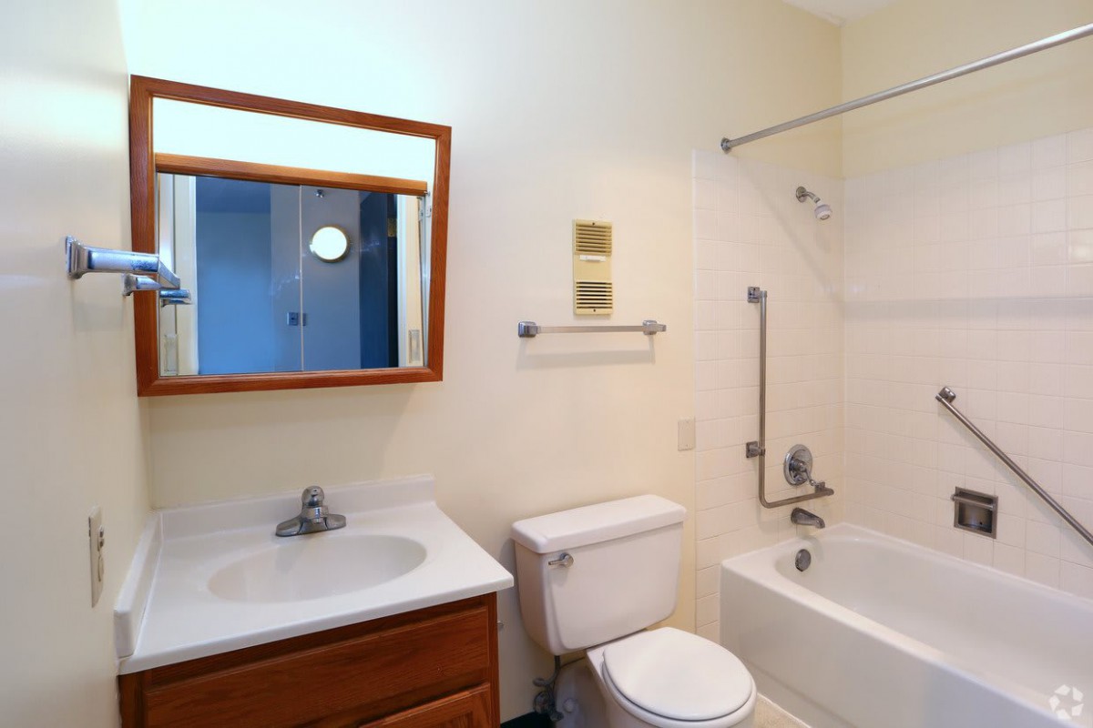 A clean and simple bathroom with essential fixtures.