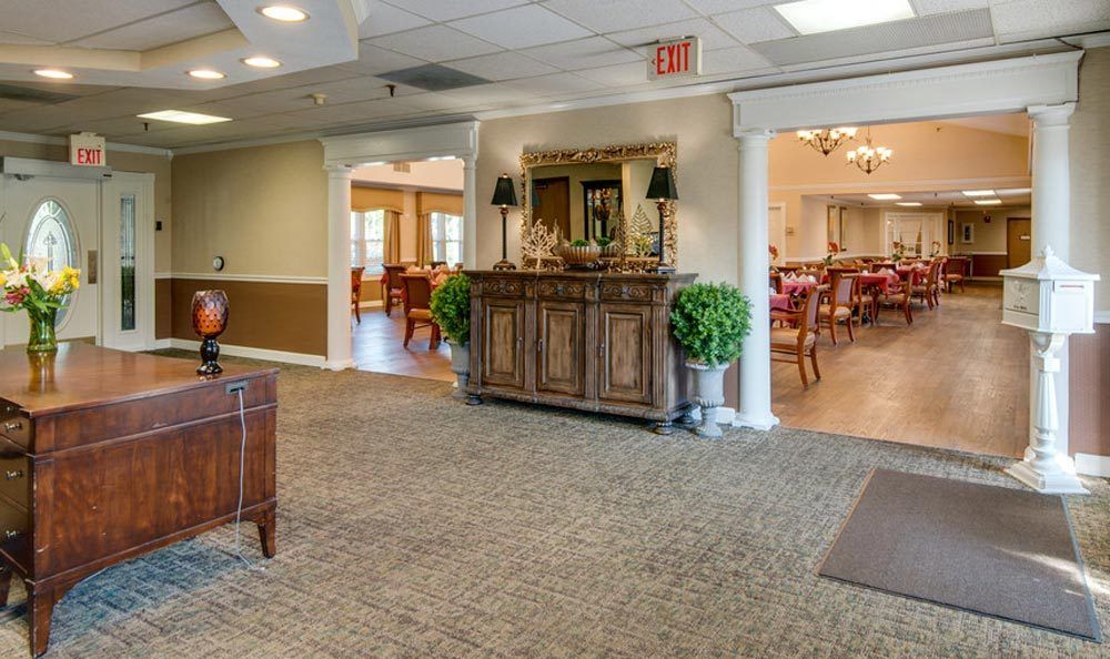 A cozy lobby area with elegant furniture and warm lighting.