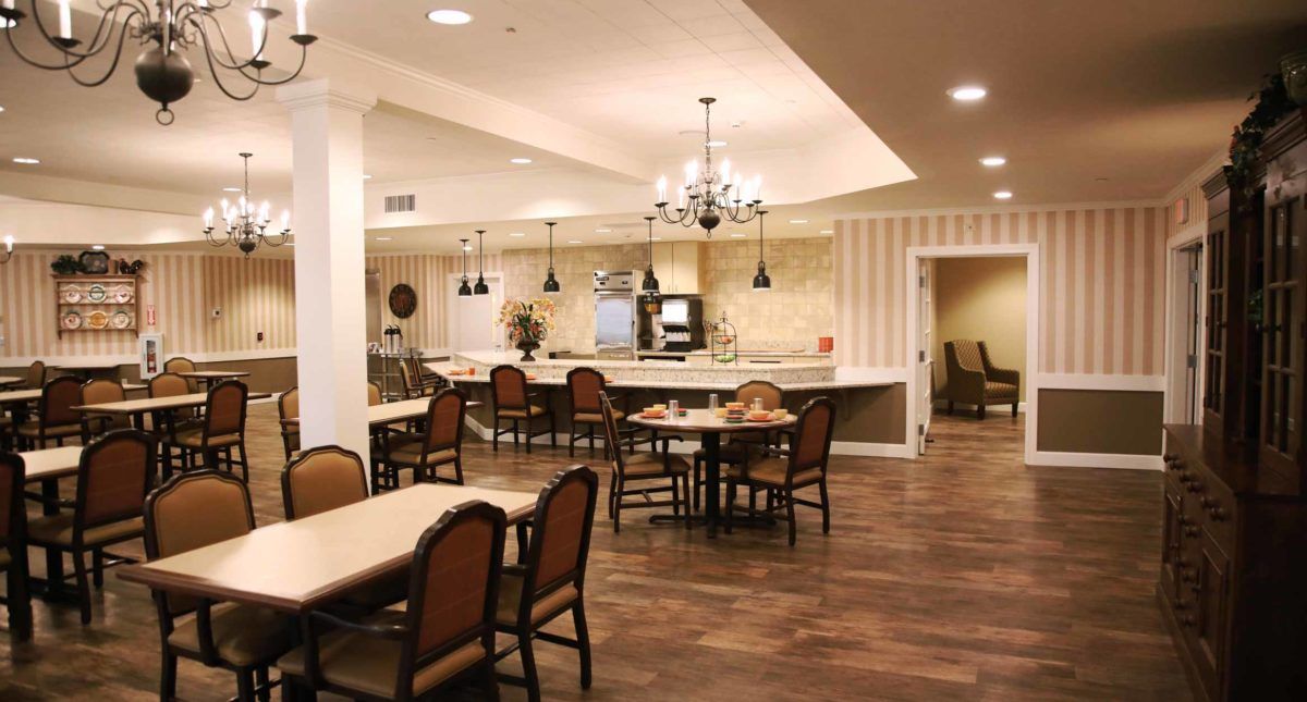 A cozy dining area with elegant chandeliers and comfortable seating.