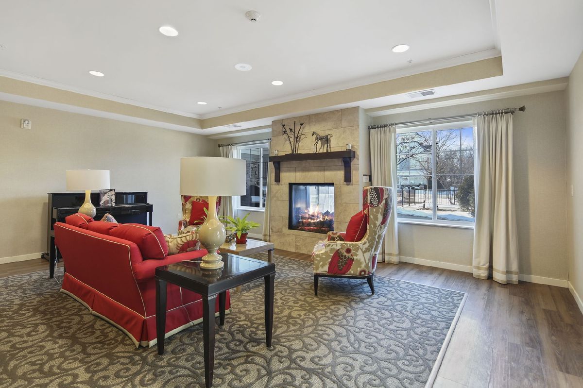 A cozy living room with elegant furniture and a fireplace.