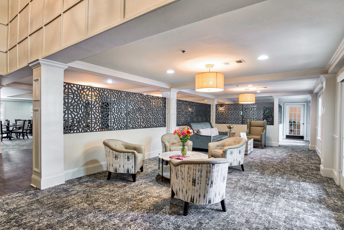 A stylish hotel lobby featuring comfortable seating and modern decor.