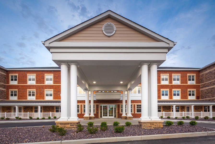 A grand building entrance featuring large columns and a symmetrical facade.