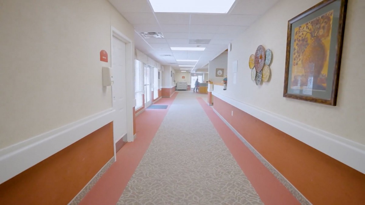 A well-lit and decorated hallway in a building.