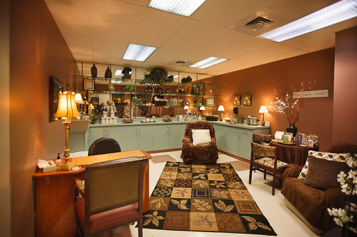 A cozy lounge area featuring comfortable seating, decorative items, and soft lighting.