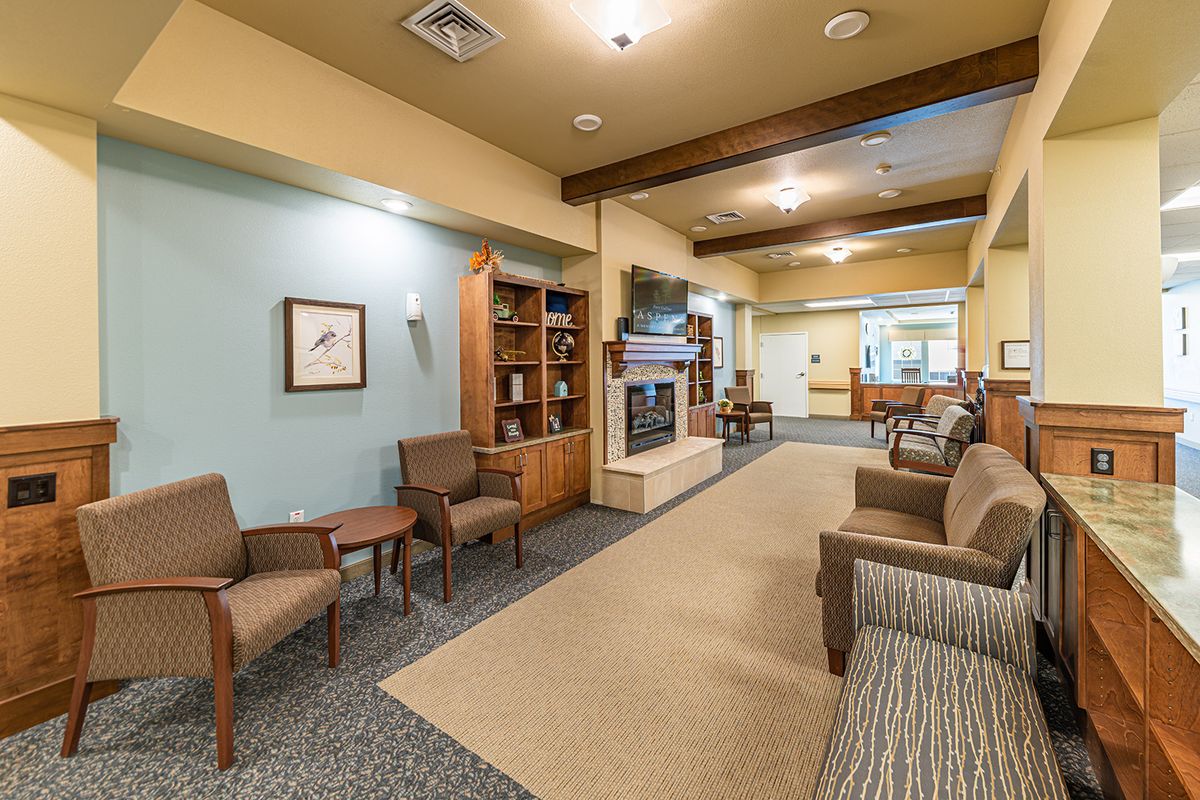 A cozy lobby area with comfortable seating and warm lighting.