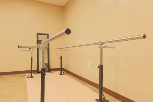A ballet barre set up in a dance studio for training and practice.