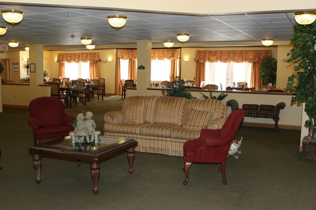 A spacious living room with comfortable seating and elegant decor.