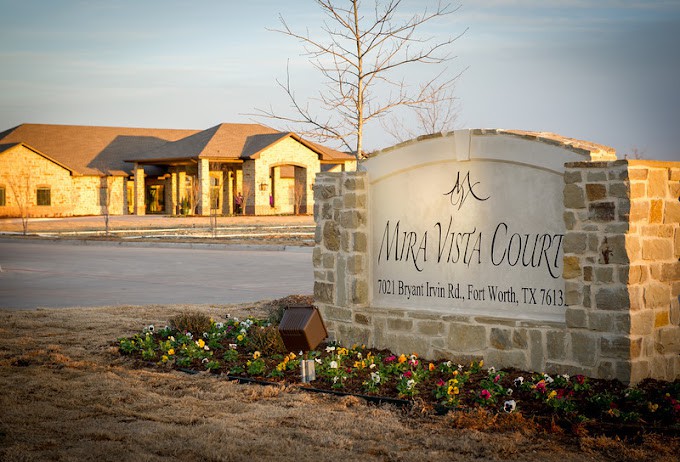 Entrance sign and building of Maya Vista Courtyards in Fort Worth, Texas.