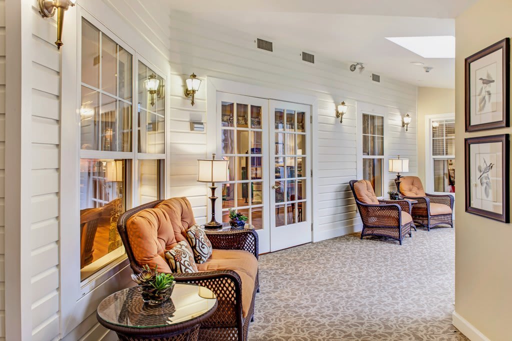 A cozy seating area with comfortable chairs and warm lighting.