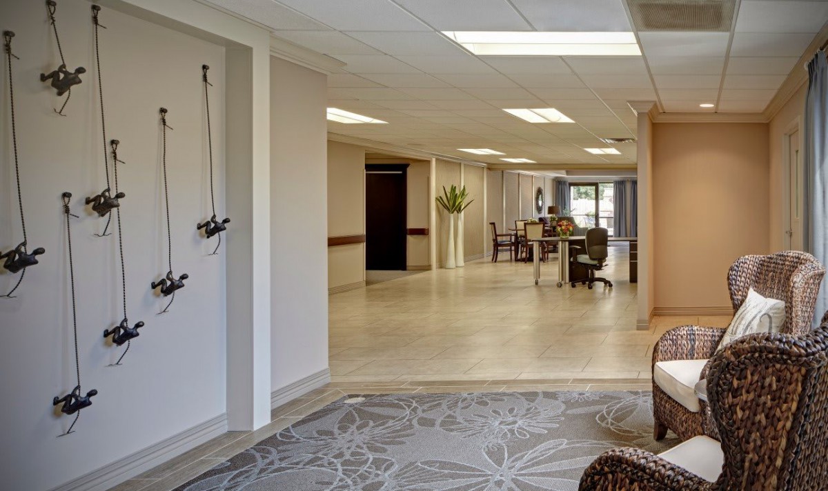 A modern and spacious lobby area with seating and a reception desk.
