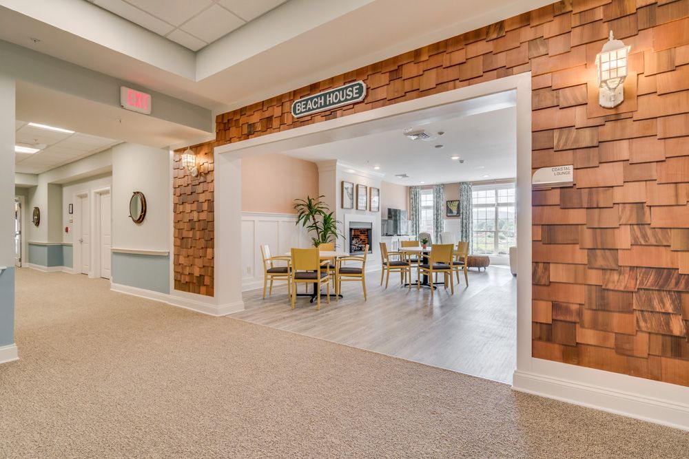 A modern dining area with wooden decor and ample natural lighting.