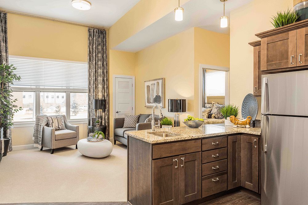 A modern open-plan kitchen and living room with stylish furnishings and decor.