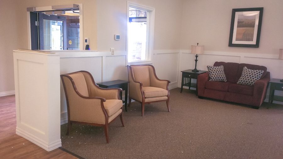 A cozy living room with elegant chairs and a comfortable sofa.