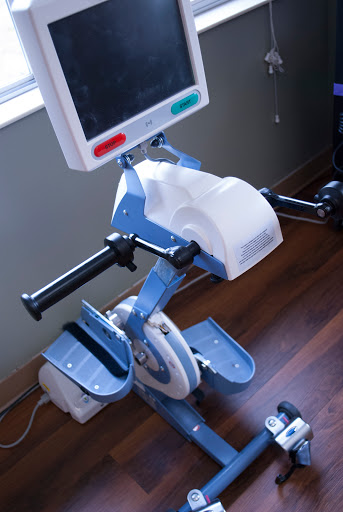 A stationary exercise bike designed for fitness and rehabilitation purposes.