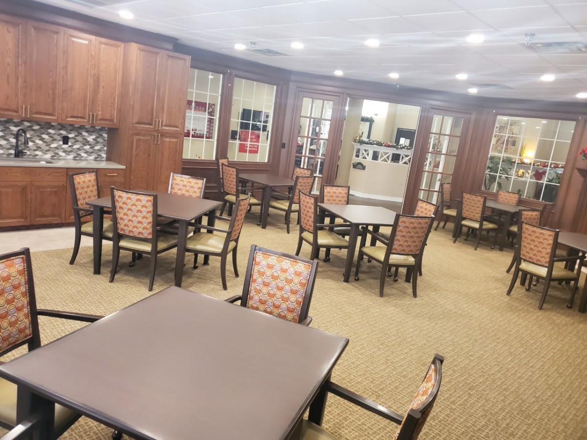 A well-organized dining area with multiple tables and chairs.