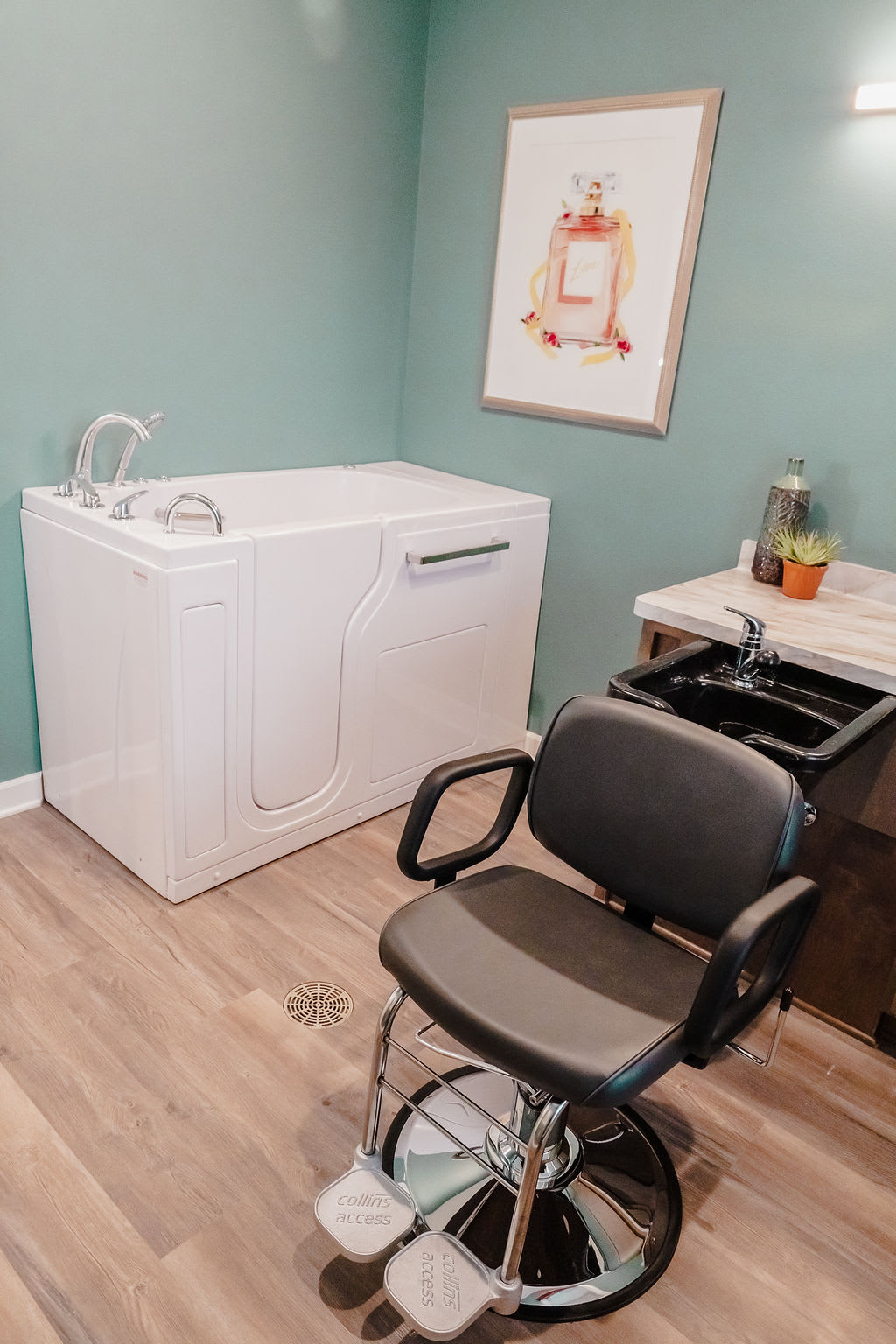 A bathroom with a walk-in bathtub and a salon-style chair.